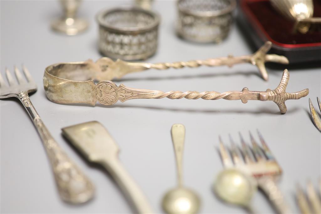 A cased pair of Victorian silver peppers, Sheffield, 1891, 79mm, five other silver condiments, etc.